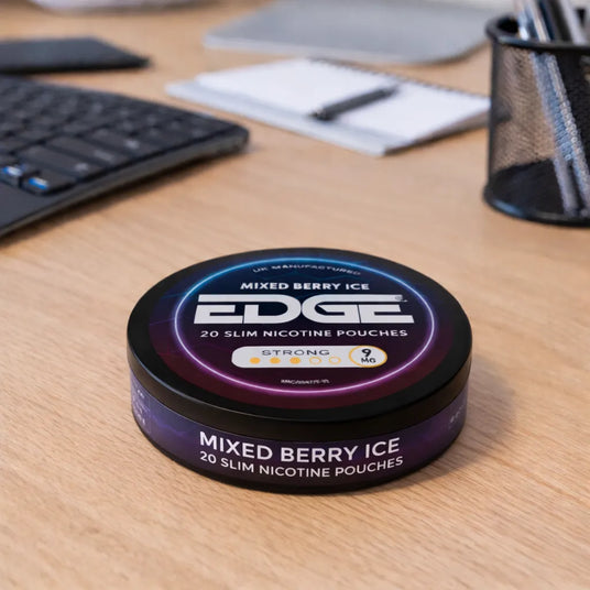 Edge Mixed Berry Ice nicotine pouch container on a desk with office supplies in the background
