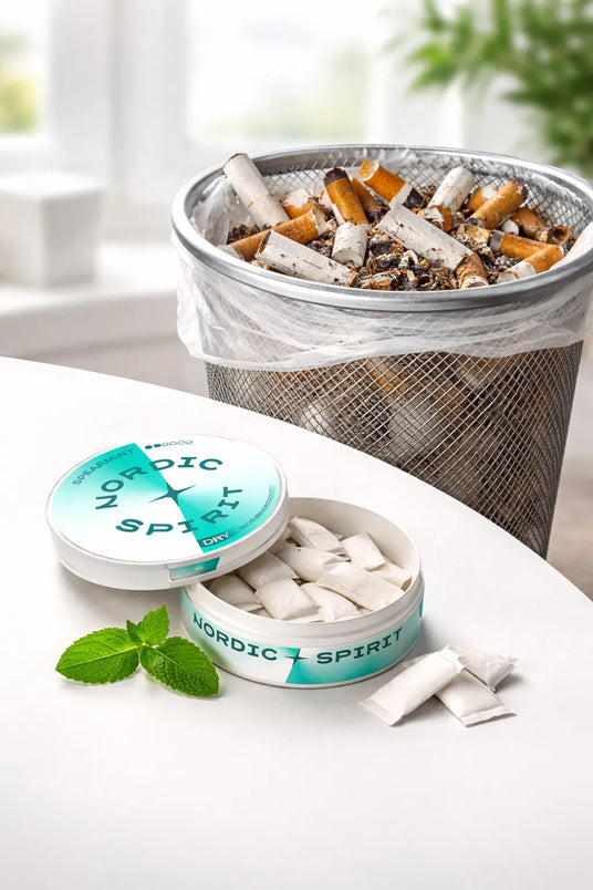 Nordic Spirit Pouches on a table with cigarettes in a waste bin